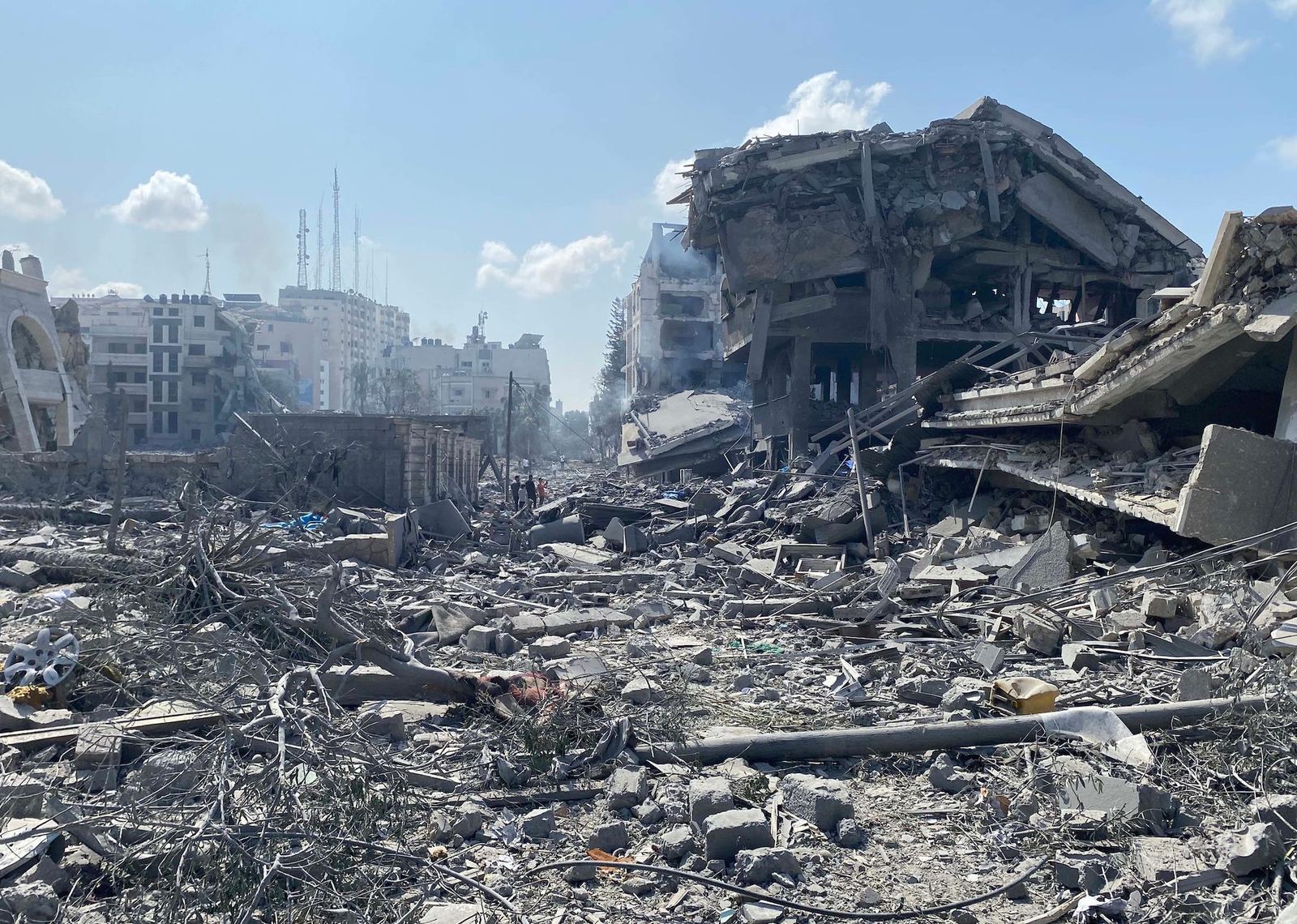 A destroyed residential street in the Rimal neighbourhood of Gaza City, buildings collapsed into rubble on both sides, following an Israeli airstrike in October 2023.